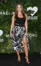 <p>Ashley Graham wore a black bodysuit with a black-and-white palm crepe-cady scissor skirt and a leather belt, all from the Spring 2018 Michael Kors Collection.</p>