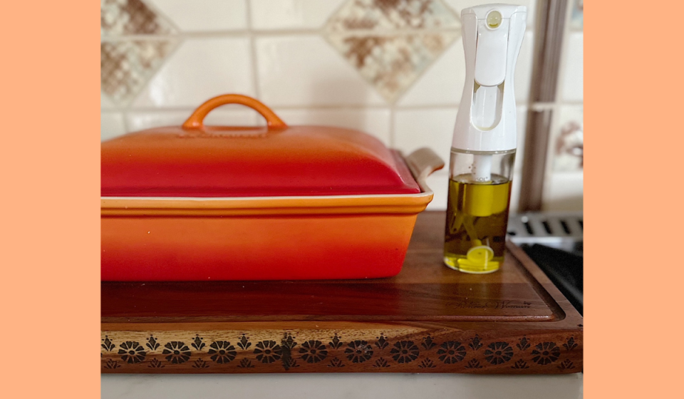 Flairosol oil sprayer next to a Le Creuset casserole dish