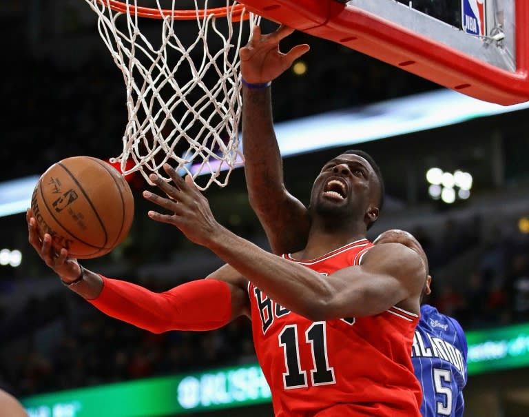 David Nwaba of the Chicago Bulls is fouled by Marreese Speights of the Orlando Magic during a 105-101 victory for the Bulls