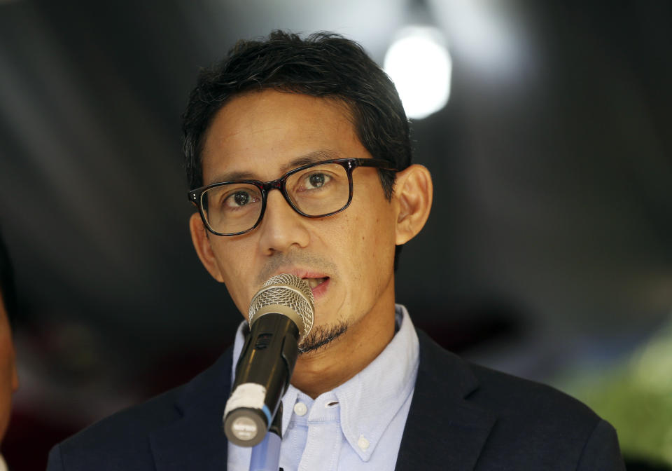 Indonesian vice presidential candidate Sandiaga Uno talks to journalists during a press conference in Jakarta, Indonesia, Friday, May 24, 2019. The defeated candidate in Indonesia's presidential elections has filed a challenge against the result in the country's top court just days after seven people died during rioting by his supporters in the capital. (AP Photo/Achmad Ibrahim)