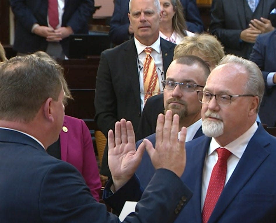 Former New Franklin Councilman Jack Daniels, at right with hand raised, is sworn in as the Ohio House 32nd District representative on April 24. He will face Democrat Jim Colopy in the Nov. 5 election.