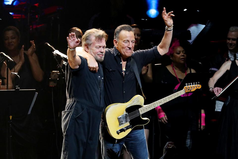 John Mellencamp (left) and Bruce Springsteen perform during a benefit in 2019 in New York City.
