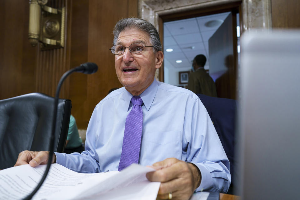 In this Aug. 5, 2021 photo, Sen. Joe Manchin, D-W.Va., prepares to chair a hearing in the Senate Energy and Natural Resources Committee, as lawmakers work to advance the $1 trillion bipartisan bill, at the Capitol in Washington. (AP Photo/J. Scott Applewhite)