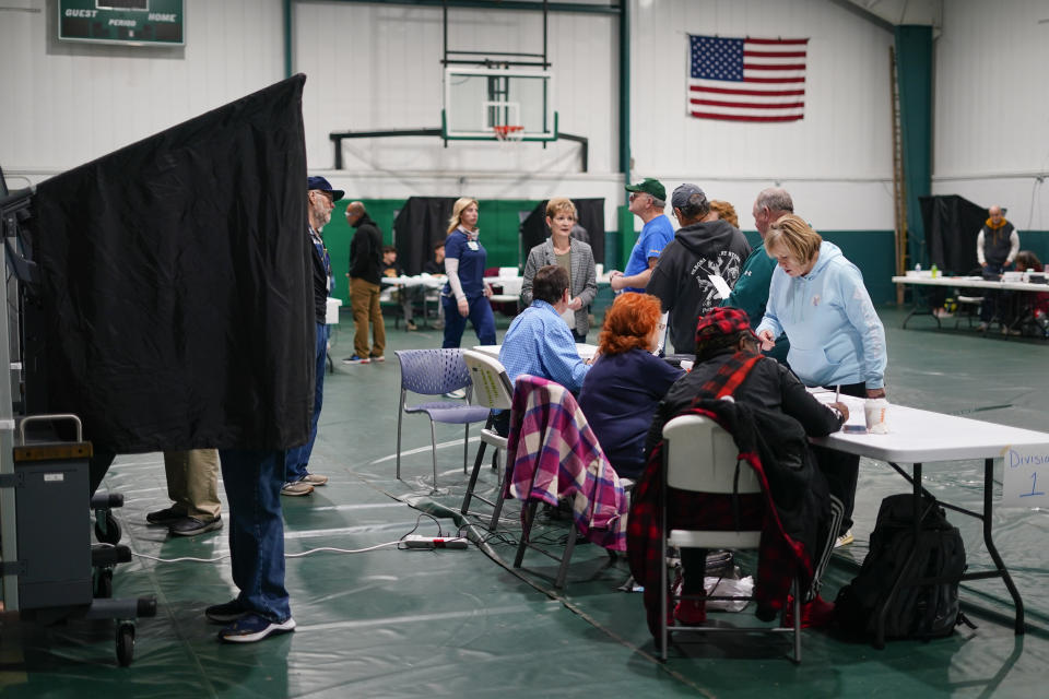 Voters check in at their polling place before casting their ballots on election day in Philadelphia, Tuesday, Nov. 7, 2023. (AP Photo/Matt Rourke)