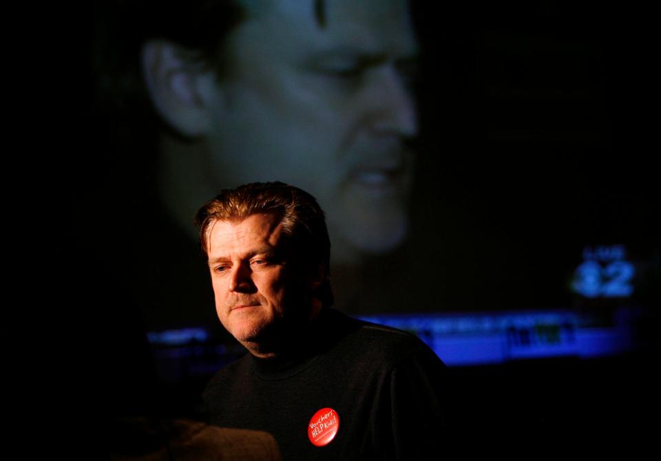 Patrick Byrne, former President and CEO of Overstock.com is reflected on a large television screen on Nov. 6, 2007. Since November 2020, Byrne has been enmeshed with supporters of former President Donald Trump trying to overturn the election results that put Democrat Joe Biden in the White House.