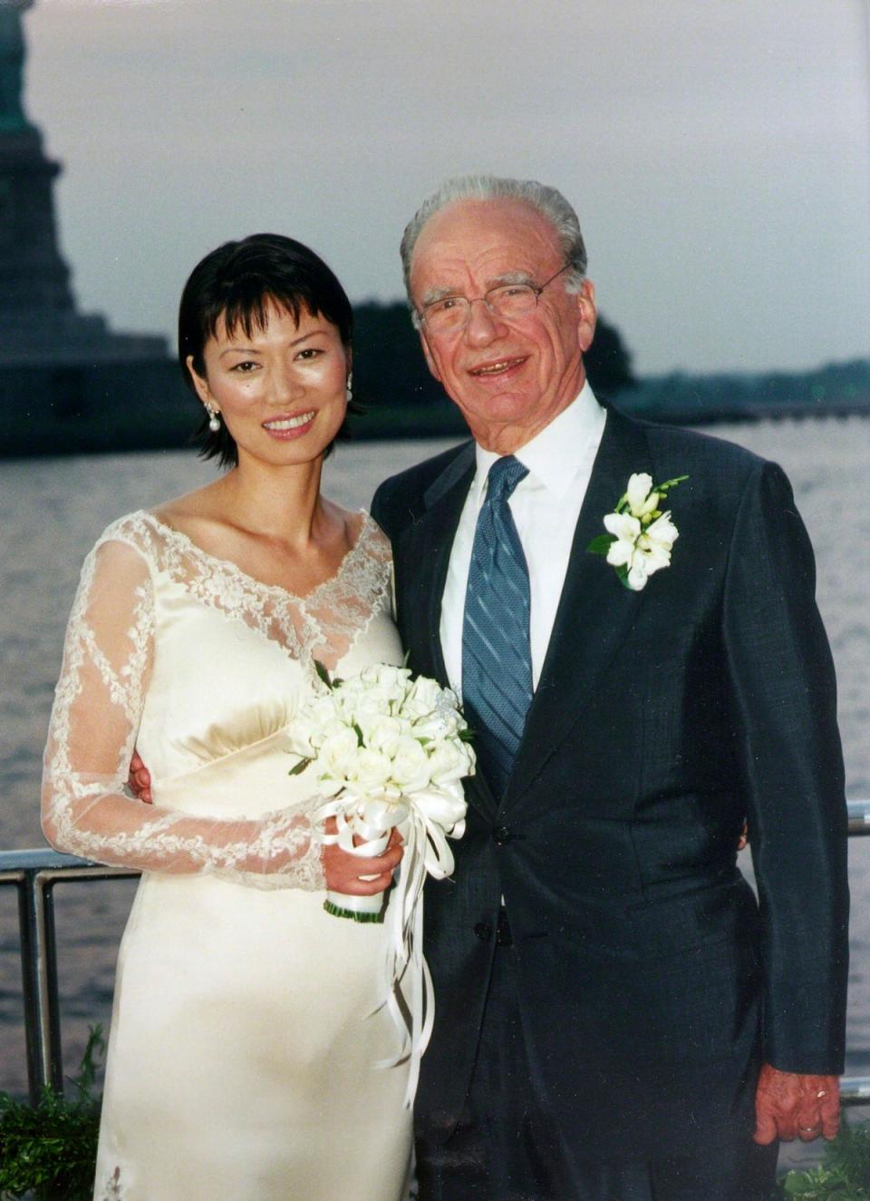 1999: News Corporation Chairman Rupert Murdoch and Wendi Deng pose near the Statue of Liberty: (REUTERS)