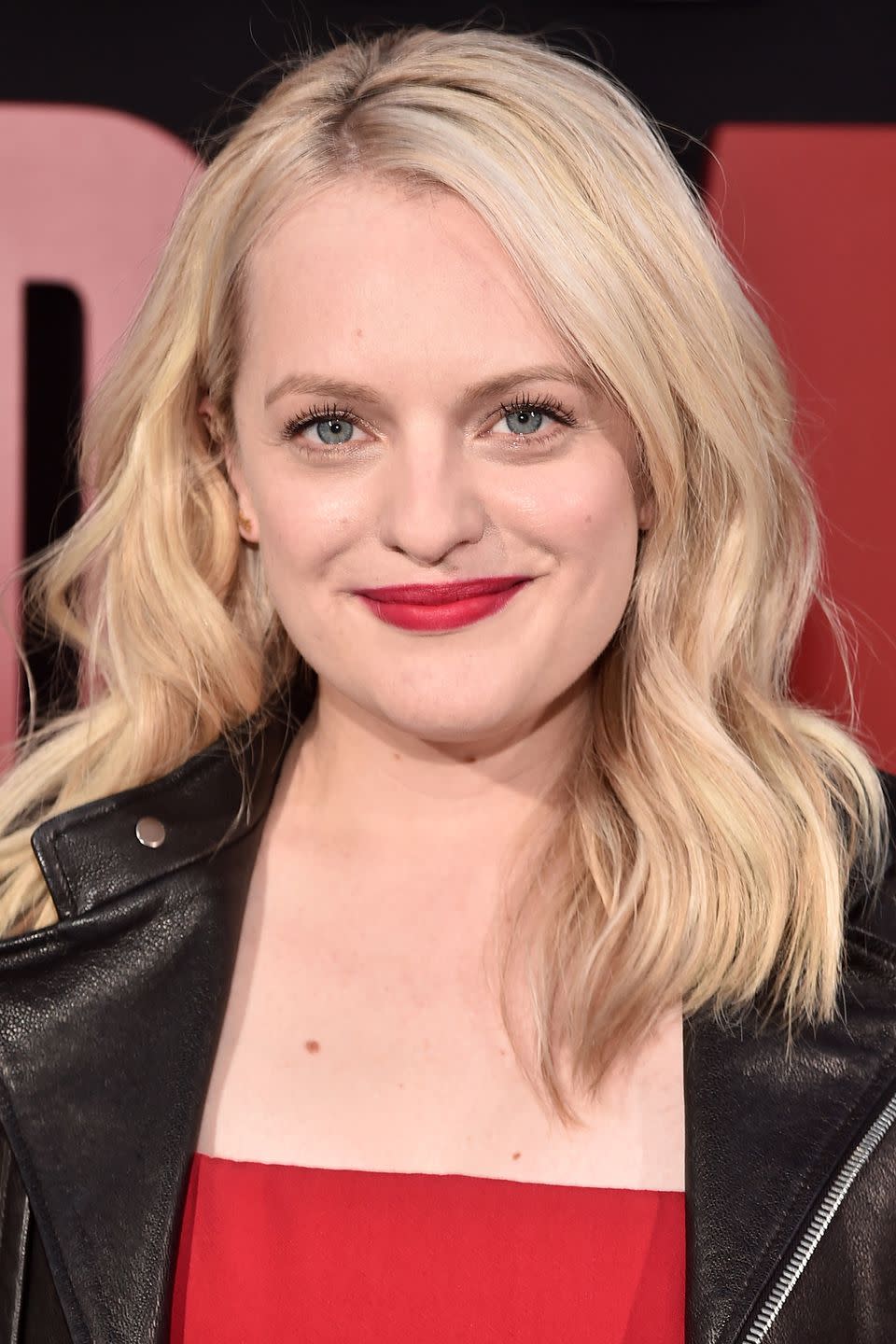 <p>Elisabeth Moss' red lipstick is the perfect shade for her skin tone, preventing her from looking washed out. If you have pale skin, like the actress, we'd recommend Dior's <a rel="nofollow noopener" href="https://www.dior.com/beauty/en_gb/fragrance-beauty/makeup/lips/lipsticks/pr-lipsticks-y0027830_f002783999-couture-colour-from-satin-to-matte-comfort-wear.html?LGWCODE=F002783999GB;143909;6271&gclid=Cj0KCQjwn-bWBRDGARIsAPS1svt7-_9VRure8UvrR1dkrrQu-KWyXsRifc7XIKwlf2egCy3-qwejey8aAmN9EALw_wcB" target="_blank" data-ylk="slk:Rouge Dior in Red Smile;elm:context_link;itc:0;sec:content-canvas" class="link ">Rouge Dior in Red Smile</a>, £29, to ensure that your lipstick complements your complexion this summer. For olive skin tones, try Mac's <a rel="nofollow noopener" href="https://www.maccosmetics.co.uk/product/13854/52593/products/makeup/lips/lipstick/retro-matte-lipstick#/shade/Ruby_Woo" target="_blank" data-ylk="slk:Ruby Woo;elm:context_link;itc:0;sec:content-canvas" class="link ">Ruby Woo</a>, £17.50, or Fenty Beauty's <a rel="nofollow noopener" href="https://www.harveynichols.com/brand/fenty-beauty/645010-stunna-lip-paint/p3024468/" target="_blank" data-ylk="slk:Stunna Lip Paint in Uncensored;elm:context_link;itc:0;sec:content-canvas" class="link ">Stunna Lip Paint in Uncensored</a>, £19, for those with darker complexions.</p>