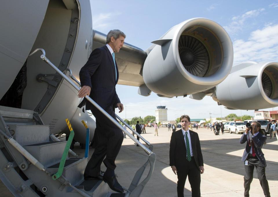 U.S. Secretary of State John Kerry arrives aboard a U.S. military airplane at Juba International Airport in Juba, South Sudan, Friday, May 2, 2014. Kerry is urging South Sudan's warring government and rebel leaders to uphold a monthslong promise to embrace a cease-fire or risk the specter of genocide through continued ethnic killings. (AP Photo/Saul Loeb, Pool)