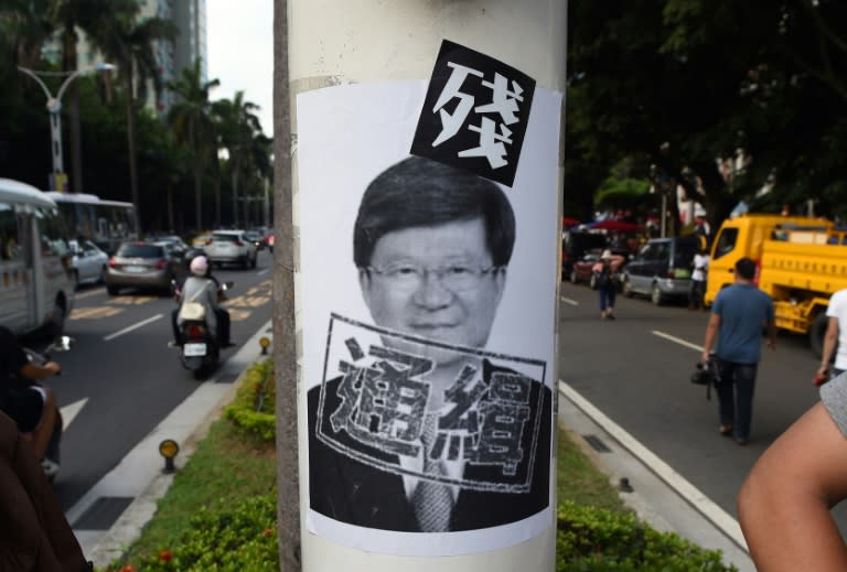 A placard bearing the portrait of Taiwan Education Minister Wu Se-hwa is seen pasted onto a lamp post during a demonstration by Taiwanese students and activists against the island's China-centric curriculum changes, in Taipei on August 2, 2015