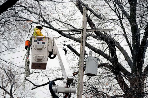 PHOTO: A DTE contractor crew works on a power line, Feb. 27, 2023, in northwest Detroit. (Carlos Osorio/AP)