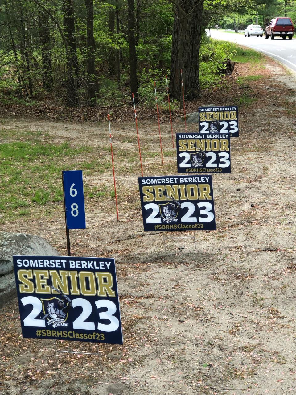 No, that's not a mistake. There are four Somerset-Berkley Class of 2023 signs on the lawn of the Lynch quadruplets' house in Berkley.