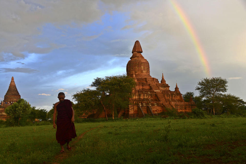 <p>A monk walks through a field near a damaged temple (R) in Bagan, southwest of Mandalay, Myanmar, Aug. 24, 2016. According to sources, a powerful 6.8 magnitude earthquake hit central Myanmar, causing two deaths and damage to several temples in the ancient city Bagan and some parts of central Myanmar. (Photo: NAING TUN WIN/EPA) </p>