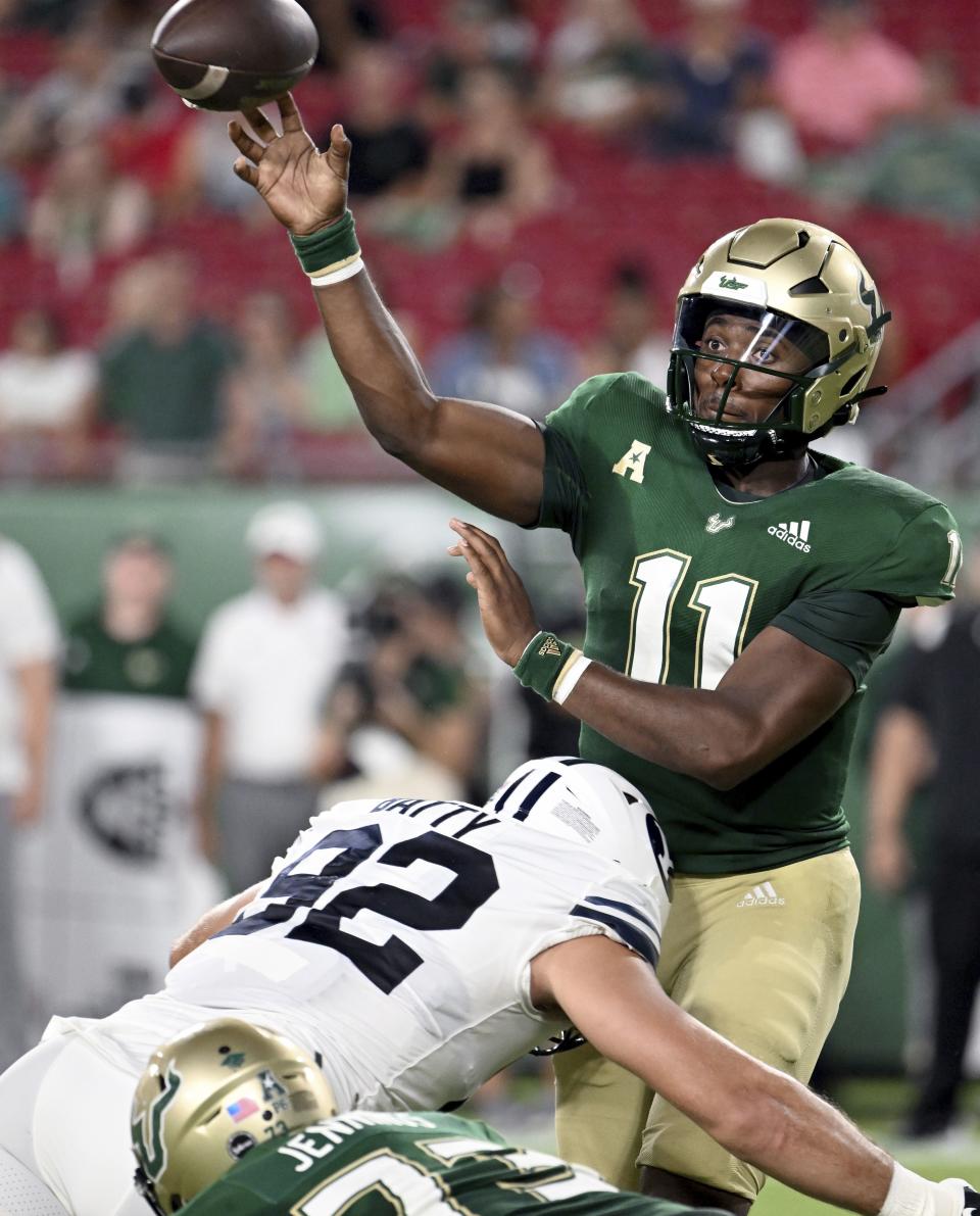 South Florida quarterback Gerry Bohanon is hit by BYU defensive lineman Tyler Batty during a game Saturday, Sept. 3, 2022, in Tampa, Fla. The former Baylor and South Florida QB is now a BYU Cougar. | Jason Behnken, Associated Press