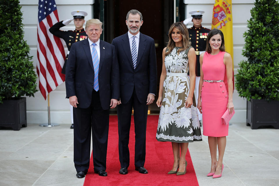 Standing alongside her husband, King Felipe VI and Queen Letizia of Spain for the Spanish royal visit, Melania wore a stunning Valentino olive green dress with intricate white floral embroidery, accessoritisng with a white crocodile belt and Manolo Blahniks. [Photo: Getty]