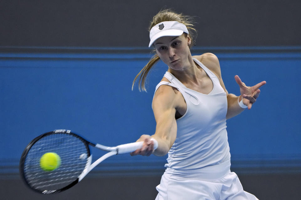 Liudmila Samsanova of Russia returns a shot to Iga Swiatek of Poland during the women's singles final match in the China Open tennis tournament at the Diamond Court in Beijing, Sunday, Oct. 8, 2023. (AP Photo/Andy Wong)