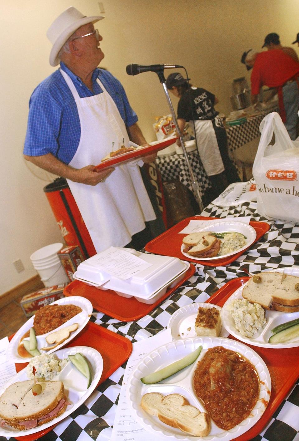 Robert Adler calls out orders during the Temple Beth El Sisterhood 17th annual Jewish Food Festival at Temple Beth El in this November 2003 file photo.