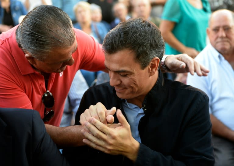 Leader of the Spanish Socialist Party Pedro Sanchez (R) greets supporters at a political meeting ahead the Galician regional election