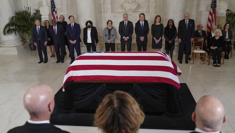 Supreme Court Chief Justice John Roberts, from left, and Justice Clarence Thomas, Justice Samuel Alito, Justice Sonia Sotomayor Justice Elena Kagan, Justice Neil Gorsuch, Justice Brett Kavanaugh, Justice Amy Coney Barrett, Justice Ketanji Brown Jackson and retired Justice Anthony Kennedy stand in front flag-draped casket of retired Supreme Court Justice Sandra Day O’Connor during a private service in the Great Hall at the Supreme Court in Washington on Monday, Dec. 18, 2023. O’Connor, a Arizona native and the first woman to serve on the nation’s highest court, died Dec. 1 at age 93.