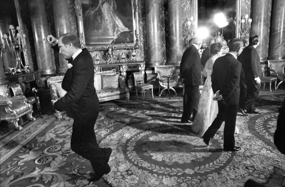 Pierre Trudeau pirouettes behind Queen Elizabeth II during a May 1977 photo session at Buckingham Palace in London. THE CANADIAN PRESS/Doug Ball