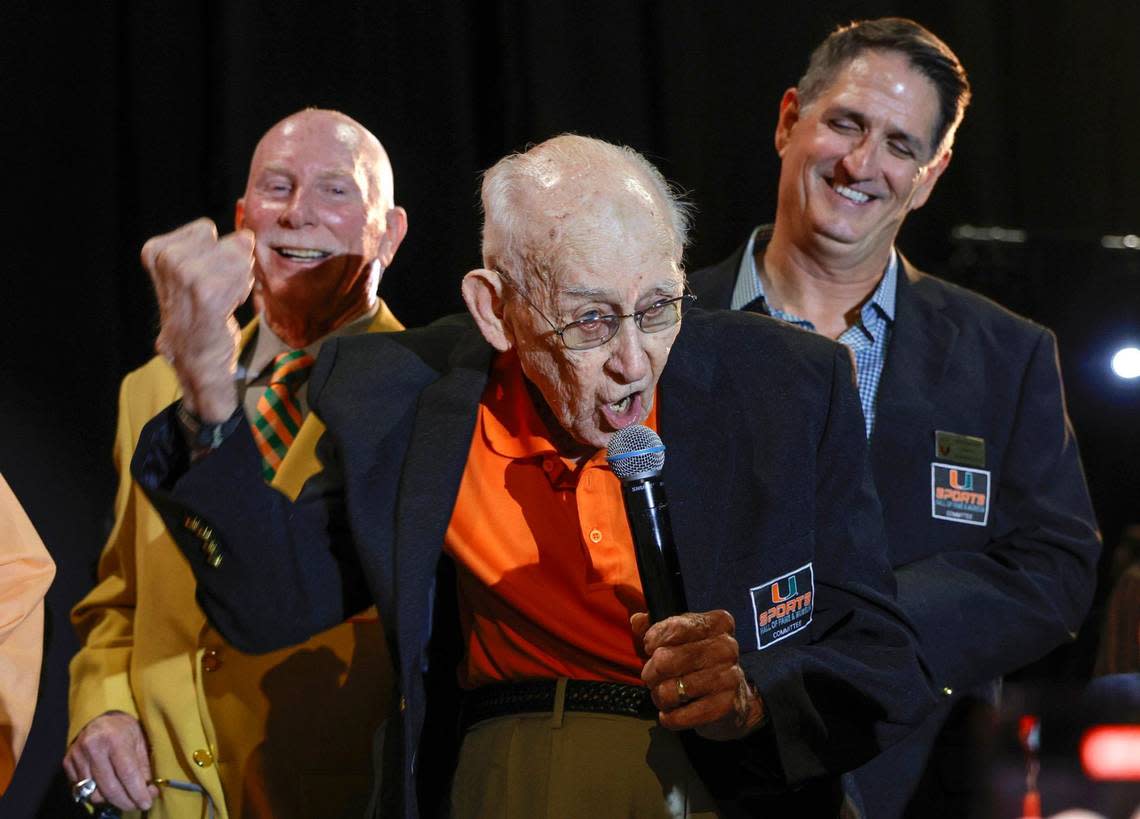 Canes fan, G. Holmes Braddock, 98, shouts “Go Canes!” as he is honored during the University of Miami’s Sports Hall of Fame & Museum 54th Induction Banquet.