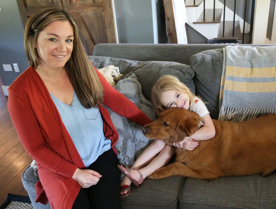 Lylah Ciampa, 4, hugs her dog while sitting still long enough for a quick photo with her mom, Becky. Lylah made a makeup tutorial by herself on her mom's phone and it got picked up by “America's Funniest Home Videos.”