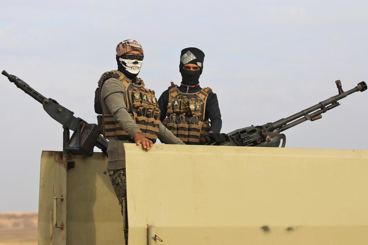 Trouble: Iraqi paramilitaries patrol near the Syrian border (Photo: AHMAD AL-RUBAYE/AFP/Getty Images): AFP/Getty Images