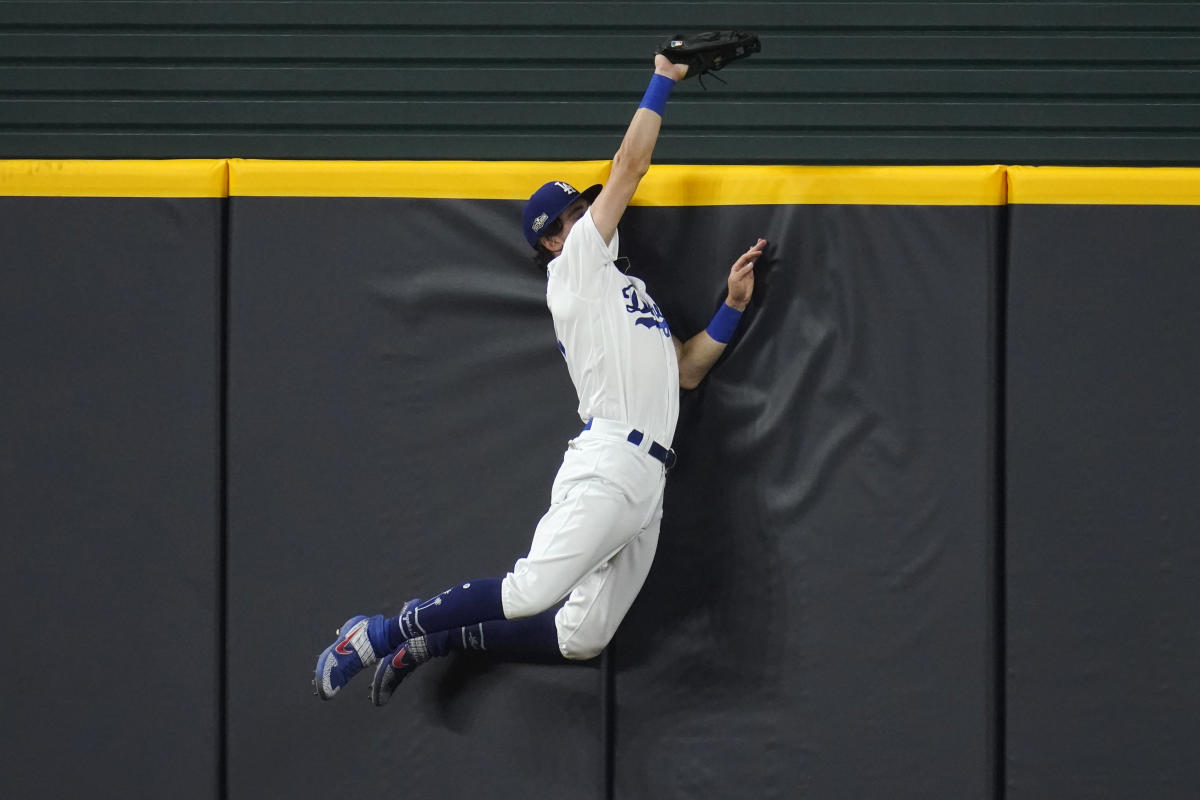 San Diego Padres shortstop Fernando Tatis Jr. holds his arm during the  eighth inning of a baseball game against the Los Angeles Dodgers Friday,  April 16, 2021, in San Diego. (AP Photo/Gregory