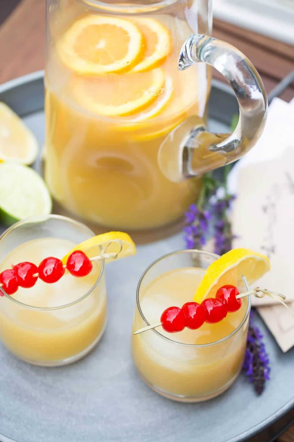 <p>Now it's a party.</p><p>Get the recipe from <a href="https://www.lemonsforlulu.com/whiskey-sour-party-punch-recipe/" rel="nofollow noopener" target="_blank" data-ylk="slk:Lemons For Lulu;elm:context_link;itc:0;sec:content-canvas" class="link ">Lemons For Lulu</a>.</p>