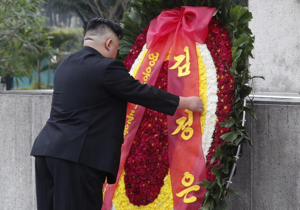 North Korean leader Kim Jong Un attends a wreath laying ceremony at Monument to War Heroes and Martyrs in Hanoi, Vietnam Saturday, March 2, 2019. Kim spent his last day in Hanoi on Saturday, laying large red-and-yellow wreaths at a war memorial and at the mausoleum of national hero Ho Chi Minh as he continued an official state visit meant to cement his image as a confident world leader after his summit breakdown with President Donald Trump. (Kham/Pool Photo via AP)
