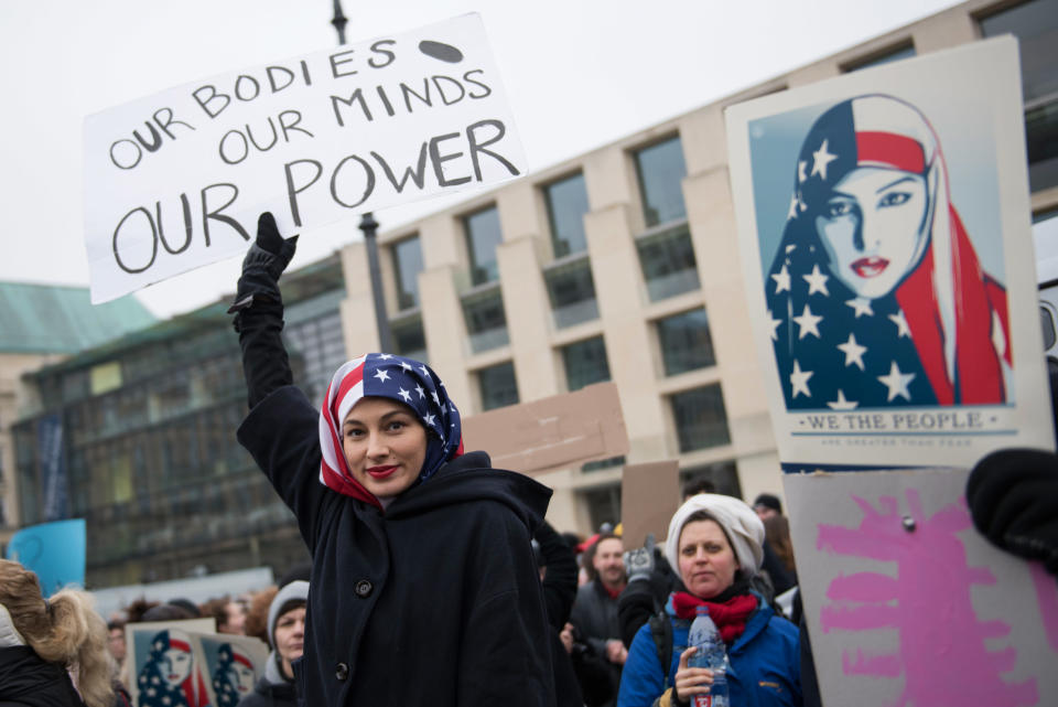 A Woman wearing a USA flag as a headscarf attends a protest for women's rights and freedom in solidarity with the Women's March on Washington in front of Brandenburger Tor on January 21, 2017 in Berlin, Germany. The Women's March originated in Washington DC but soon spread to be a global march calling on all concerned citizens to stand up for equality, diversity and inclusion and for Women's rights to be recognized around the world as human rights.&nbsp;