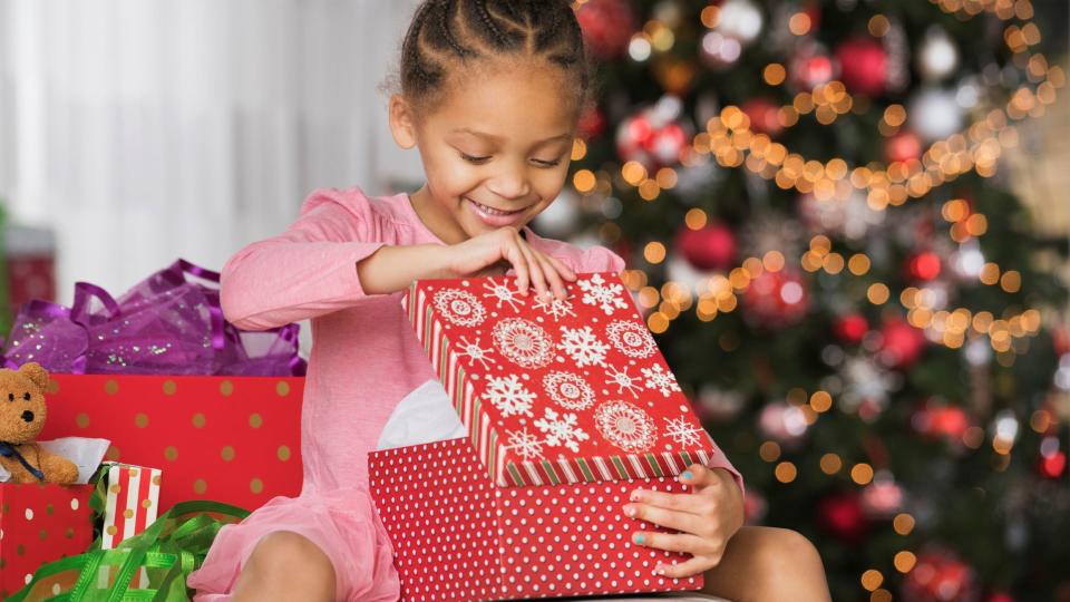 Happy child opening gift