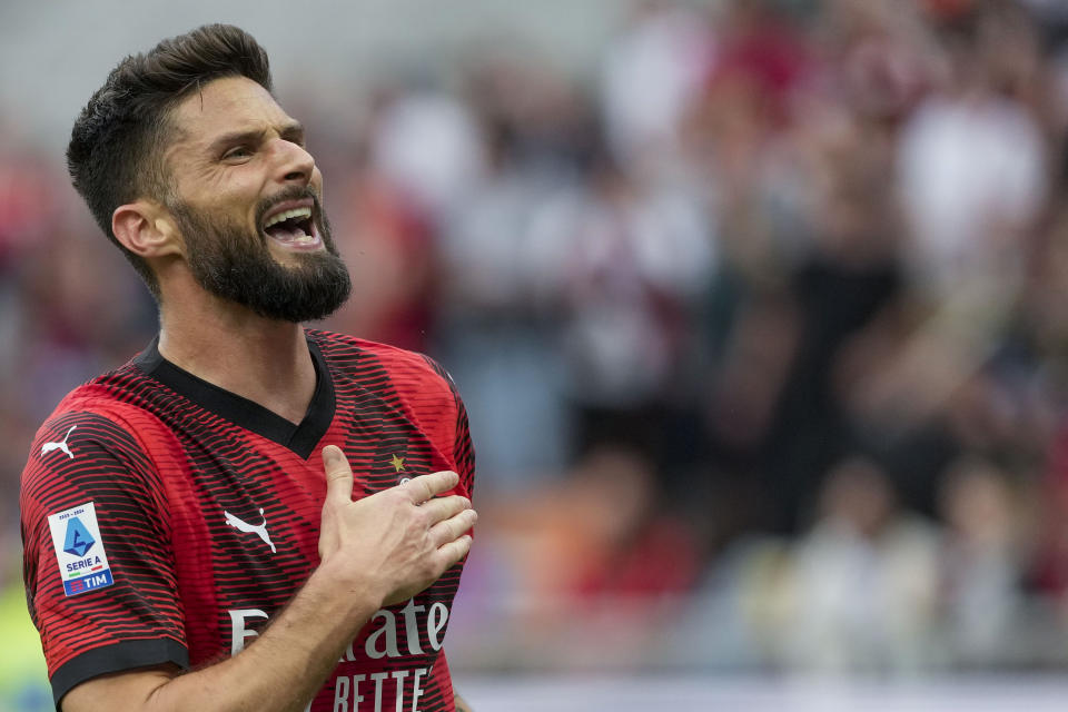 AC Milan's Olivier Giroud celebrates after scoring his side's third goal during a Serie A soccer match between AC Milan and Genoa, at the San Siro stadium in Milan, Italy, Sunday, May 5, 2024. (AP Photo/Luca Bruno)