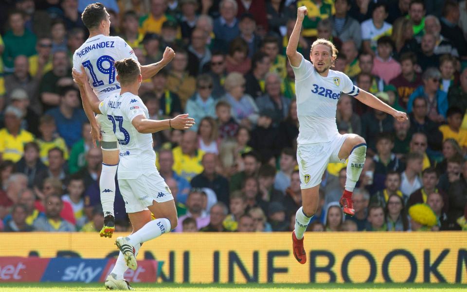 Leeds celebrate scoring their third goal in the 3-0 victory over Norwich last August - PA