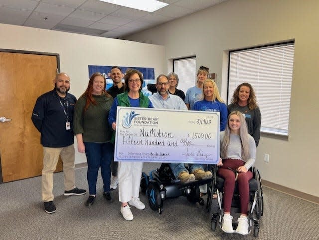 The Sister-Bear Foundation has awarded $3,849 in its first Quarter 2023 grants to three recipients: David Flores, Brittan Carrier and Theresa Rowe, for specialty assistance items not covered by insurance. Carrier, center, received a $1,500 grant to cover the cost of a seat elevator adapter for his electric wheelchair.