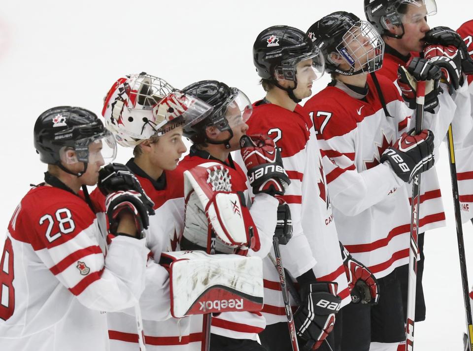 Canada's (L-R) Anthony Mantha, goalie Zachary Fucale, Charles Hudon, Adam Pelech, Connor McDavid, and Derrick Pouliot react following their loss to Russia in their IIHF World Junior Championship bronze medal ice hockey game in Malmo, Sweden, January 5, 2014. REUTERS/Alexander Demianchuk (SWEDEN - Tags: SPORT ICE HOCKEY)