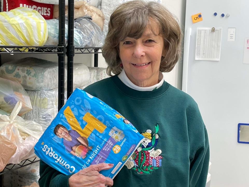 Marj West organizes the diapers at Shepherd of Hope Food Pantry at Faith Lutheran Church, 225 Jamestown Blvd. Dec. 4, 2023.