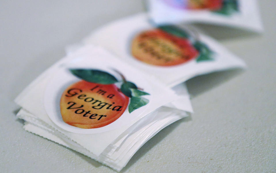<p>‘I’m a Georgia Voter’ stickers are available for people to cast their ballots during a special election in Georgia’s 6th Congressional District special election at St. Bede’s Episcopal Church on June 20, 2017 in Tucker, Ga. (Photo: Joe Raedle/Getty Images) </p>