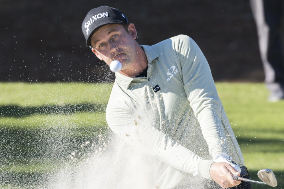 Andrew Putnam hits out of a bunker on the ninth green during the second round of the RSM Classic golf tournament, Friday, Nov. 18, 2022, in St. Simons Island, Ga. (AP Photo/Stephen B. Morton)