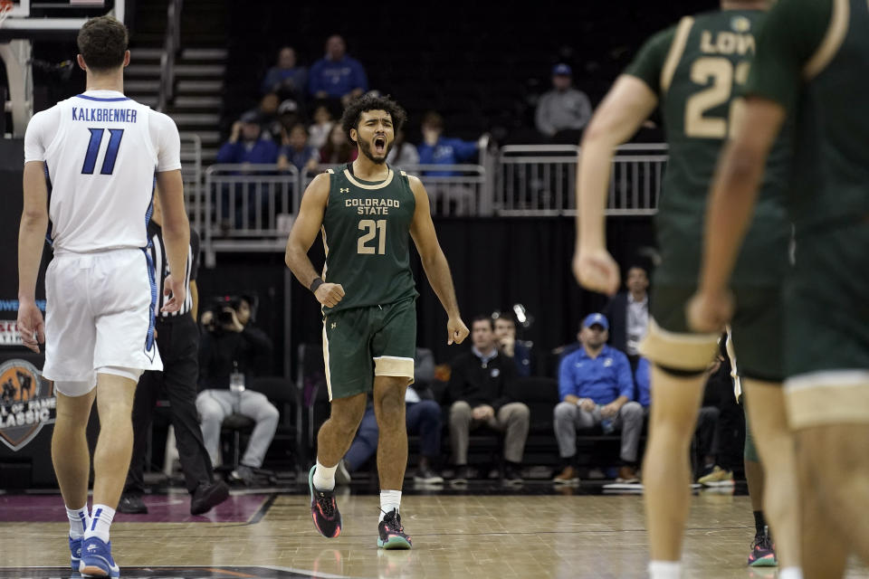 Colorado State guard Rashaan Mbemba (21) celebrates a basket during the second half of an NCAA college basketball game against Creighton Thursday, Nov. 23, 2023, in Kansas City, Mo. Colorado State won 69-48. (AP Photo/Charlie Riedel)