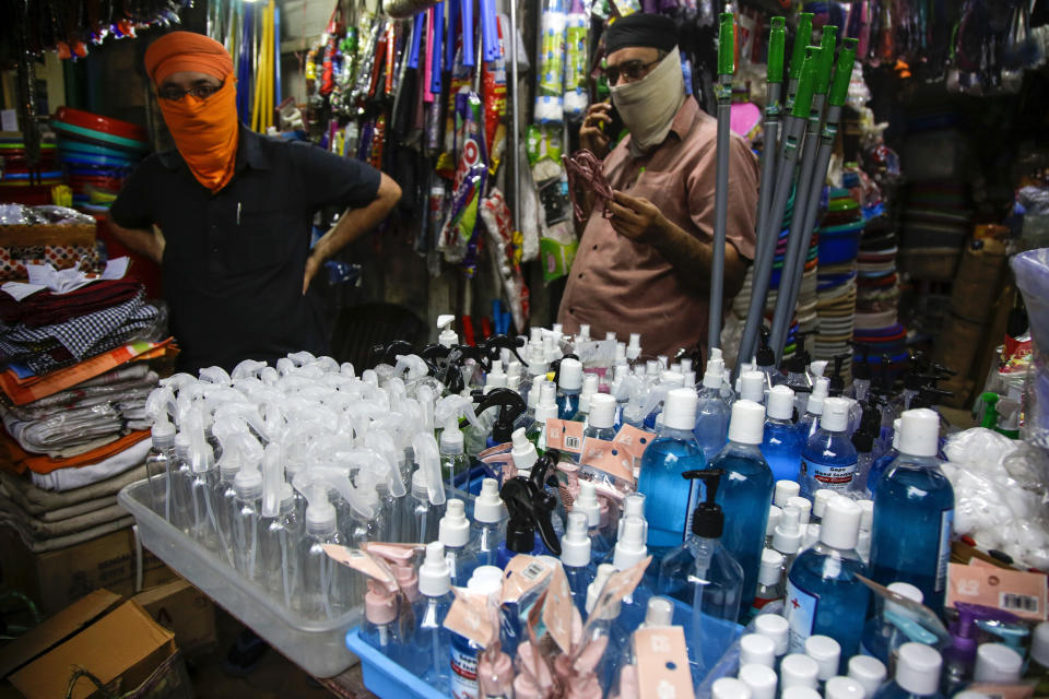 Hand sanitizers and empty containers are displayed for sale in Kolkata, India, Friday, June 19, 2020. India is the fourth hardest-hit country by the COVID-19 pandemic in the world after the U.S., Russia and Brazil. (AP Photo/Bikas Das)