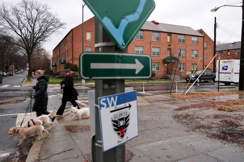 Signs point the way to a nature trail and a new soccer stadium near the home Woody and her grandson share in Washington