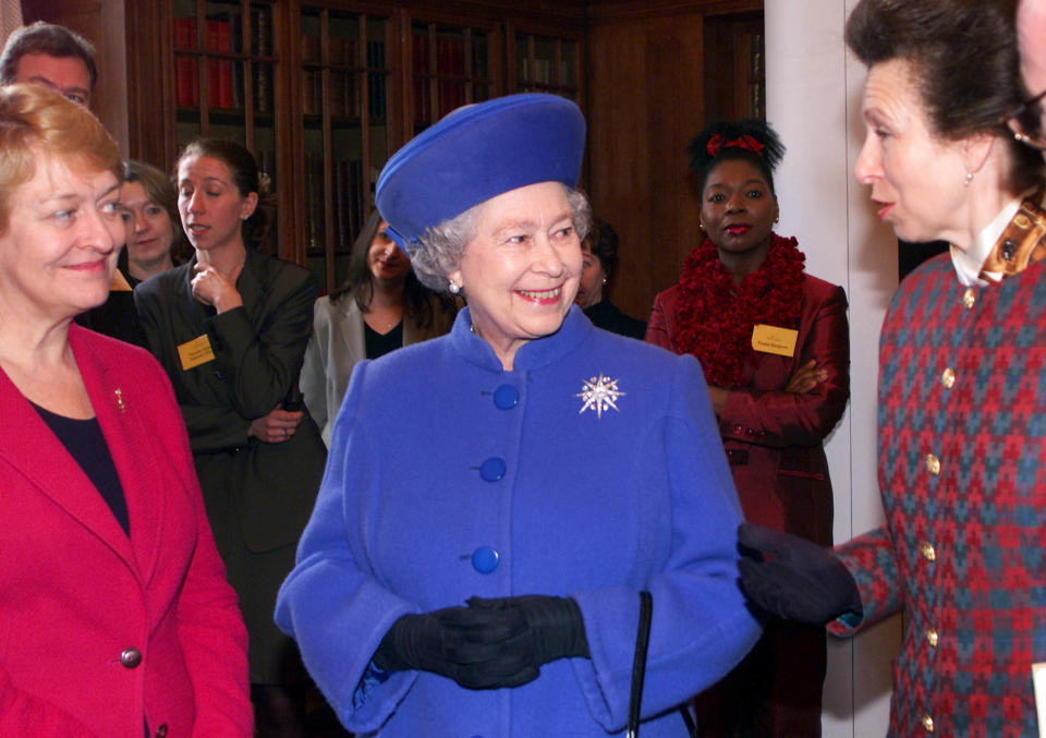 Queen Elizabeth II (C) talks with the Princess Royal (R) and Dame Helen Reeves (L), Chief Executive of Victim Support, during a meeting with members of the voluntary sector in the London Marriott Hotel, County Hall.  * The Queen and Princess Anne attended the launch of Victim's Support's new volunteer recruitment campaign, meeting volunteers some of whom have been victims of crime.   (Photo by PA Images via Getty Images)