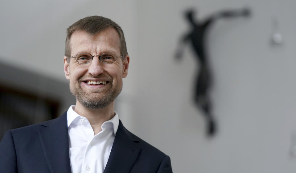 Jesuit Father Jan Korditschke, who will lead blessings for same-sex couples in Berlin in the upcoming week, poses for a photo at the Canisius Church in Berlin, Germany, Friday, May 7, 2021. Germany’s Catholic progressives are openly defying a recent Holy See pronouncement that priests cannot bless same-sex unions by offering exactly such blessings at services in about 100 different churches all over the country. The blessings at open worship services are the latest pushback from German Catholics against a document released in March by the Vatican’s orthodoxy office, which said Catholic clergy cannot bless same-sex unions. (AP Photo/Michael Sohn)