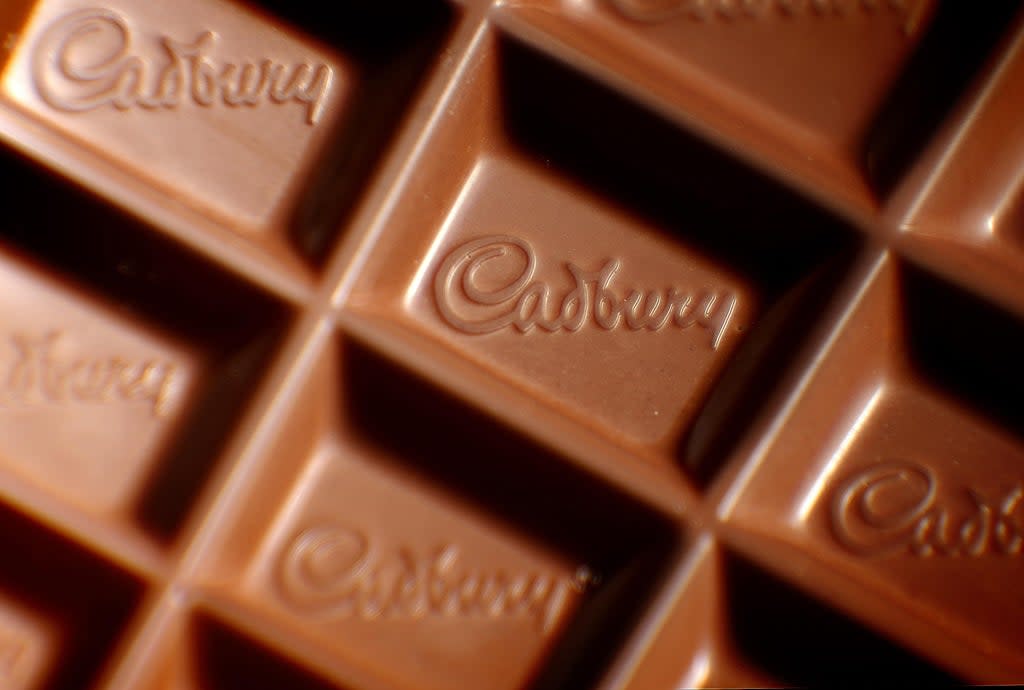 A closeup of a Cadbury logo in a bar of Dairy Milk chocolate. The confectionery company has reduced the size of previously 200g bars to 180g because of rising costs making the bars (Dominic Lipinski/PA) (PA Archive)