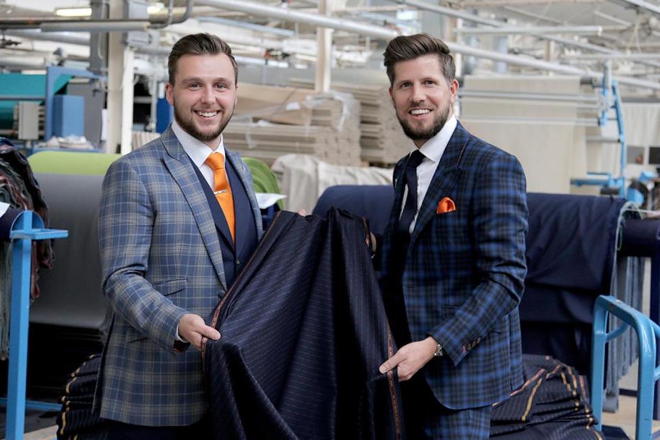 The F*** You suit can now be bought on Savile Row, the cloth is seen here being held by Scott Hufton, right, and his business partner Andy Littlewood