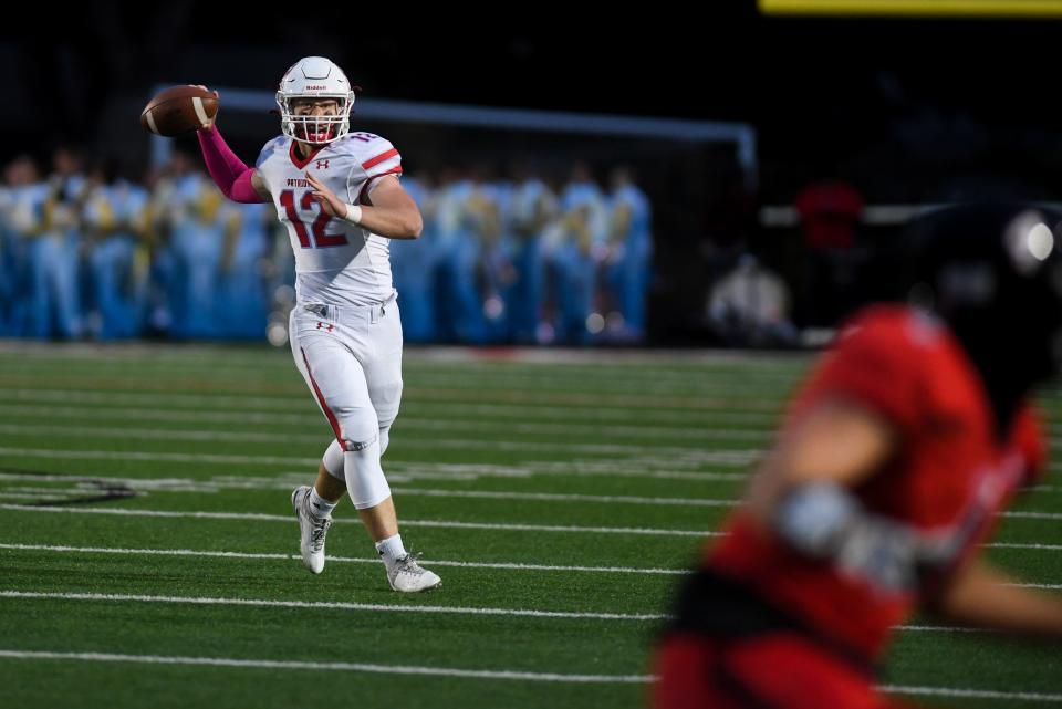 Lincoln's Tate Schafer (12) attempts to pass the ball to another player on Friday, Oct. 6, 2023 at Brandon Valley High School in Brandon, South Dakota.