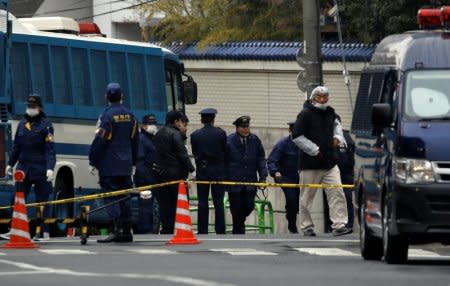 Police officers are seen in front of the headquarters of the General Association of Korean Residents in Japan (Chongryon), after police arrested two men suspected of shooting in to the building in Tokyo, Japan, February 23, 2018. REUTERS/Toru Hanai