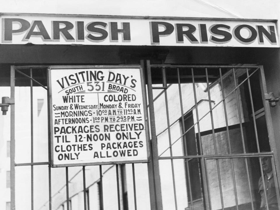 Entrance to New Orleans Parish Prison, showing segregated visiting periods.