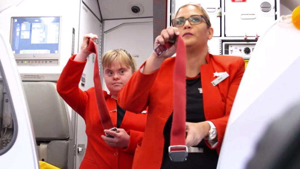 The 25-year-old gets involved in the safety demonstration. Source: Jetstar Australia