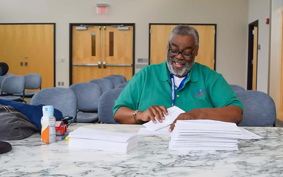 FILE - Joe Glover Jr., of Sheboygan ,works through paperwork at the municipal court, Thursday morning, July 7, 2016, in Sheboygan, Wis.